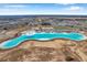Aerial view of a large lagoon amenity in a residential area at 31371 Cabana Rye Ave, San Antonio, FL 33576