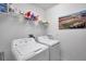 Laundry room with washer, dryer, and shelving at 31371 Cabana Rye Ave, San Antonio, FL 33576