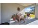 Covered patio with wicker furniture and a view of the backyard at 31371 Cabana Rye Ave, San Antonio, FL 33576