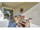 Covered patio with wicker furniture, providing a shaded seating area at 31371 Cabana Rye Ave, San Antonio, FL 33576