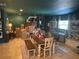 Formal dining room with a wood table and built-in shelving at 3240 Apfel Rd, Wesley Chapel, FL 33543