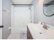 Bathroom with a shower and tub combination, a wooden vanity, and sleek chrome fixtures at 5627 War Admiral Dr, Wesley Chapel, FL 33544