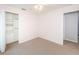 Bright bedroom featuring carpet flooring, a ceiling fan, and a closet with built-in shelving at 5627 War Admiral Dr, Wesley Chapel, FL 33544