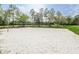 Sand volleyball court with net and grassy area at 5627 War Admiral Dr, Wesley Chapel, FL 33544