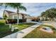 Attractive neighborhood street scene featuring well-kept lawns and varied home styles at 5627 War Admiral Dr, Wesley Chapel, FL 33544