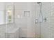 Clean bathroom with white subway tiles, glass shower door, and built-in bench at 5706 N Branch Ave, Tampa, FL 33604