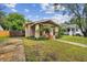 House with a spacious front yard at 5706 N Branch Ave, Tampa, FL 33604