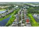 Aerial view of the home and surrounding community near a lake at 6836 Park Strand Dr, Apollo Beach, FL 33572