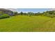 Expansive backyard with pond and privacy fence at 6836 Park Strand Dr, Apollo Beach, FL 33572