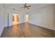 Main bedroom with hardwood floors and access to bathroom and closet at 6836 Park Strand Dr, Apollo Beach, FL 33572