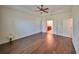 Spacious bedroom with hardwood floors and ensuite bathroom at 6836 Park Strand Dr, Apollo Beach, FL 33572