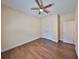 Well-lit bedroom with hardwood floors and double door closet at 6836 Park Strand Dr, Apollo Beach, FL 33572