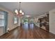 Bright dining room with hardwood floors and a chandelier at 6836 Park Strand Dr, Apollo Beach, FL 33572