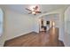 Bright dining room with hardwood floors and view into kitchen at 6836 Park Strand Dr, Apollo Beach, FL 33572