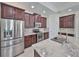 Modern kitchen with granite countertops and stainless steel appliances at 6836 Park Strand Dr, Apollo Beach, FL 33572