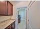 Laundry room with washer, dryer, and built-in cabinets at 6836 Park Strand Dr, Apollo Beach, FL 33572