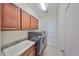 Laundry room with cabinets, sink and newer appliances at 6836 Park Strand Dr, Apollo Beach, FL 33572
