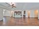 Open concept living area with hardwood floors and kitchen views at 6836 Park Strand Dr, Apollo Beach, FL 33572