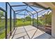 Relaxing screened porch with view of lush landscaping at 6836 Park Strand Dr, Apollo Beach, FL 33572