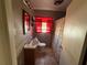 Bathroom with red accents and tiled floors at 1005 N Paddock Ave, Tampa, FL 33607