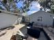 Large backyard with patio furniture and a covered area at 1104 Winchester N Rd, St Petersburg, FL 33710