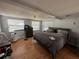 Bedroom with a queen-size bed and plenty of natural light at 1104 Winchester N Rd, St Petersburg, FL 33710