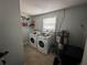 Laundry room with washer, dryer, and extra storage at 1104 Winchester N Rd, St Petersburg, FL 33710