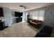 Bright living room featuring a large TV and comfy seating at 1104 Winchester N Rd, St Petersburg, FL 33710