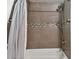 Shower/tub combo with tile surround and mosaic accent at 1308 Ivywood Dr, Brandon, FL 33510