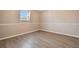 Spacious bedroom with laminate flooring, neutral walls, and chair rail molding at 1308 Ivywood Dr, Brandon, FL 33510