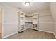 Bright walk-in closet with built-in shelving and hanging rod at 1308 Ivywood Dr, Brandon, FL 33510