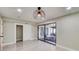 Bright living room with tile floors and glass doors to the sunroom at 15722 Gardenside Ln, Tampa, FL 33624