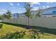 Landscaped backyard with a privacy fence at 1579 Hubbell Rd, Wesley Chapel, FL 33543