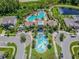 Aerial view of community amenities including pool, clubhouse, and splash pad at 1579 Hubbell Rd, Wesley Chapel, FL 33543