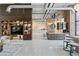 Open amenity space features a kitchenette, built-in shelves, and stylish seating at 175 2Nd S St # P-08, St Petersburg, FL 33701