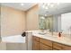 Elegant bathroom with a soaking tub, marble vanity, and modern fixtures at 175 2Nd S St # P-08, St Petersburg, FL 33701