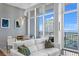 Bright dining room area featuring floor to ceiling windows with balcony access and a modern table at 175 2Nd S St # P-08, St Petersburg, FL 33701