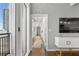 Hallway leading to living area with water views and bright walls at 175 2Nd S St # P-08, St Petersburg, FL 33701