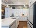 Modern white kitchen with marble island and stainless steel appliances at 175 2Nd S St # P-08, St Petersburg, FL 33701