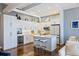 Modern white kitchen with marble countertops and island at 175 2Nd S St # P-08, St Petersburg, FL 33701