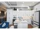 Bright, open kitchen with white cabinetry, marble countertops, and stainless steel appliances at 175 2Nd S St # P-08, St Petersburg, FL 33701