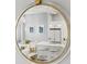 Modern kitchen with a marble island, sleek white cabinets, and contemporary lighting as seen in a mirror at 175 2Nd S St # P-08, St Petersburg, FL 33701