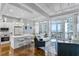 Bright living space featuring an open floor plan, modern furnishings, and balcony access with stunning ocean views at 175 2Nd S St # P-08, St Petersburg, FL 33701