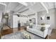 Bright living space featuring an open floor plan with kitchen, modern furnishings, and a living room area rug at 175 2Nd S St # P-08, St Petersburg, FL 33701
