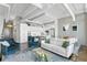 Bright living space featuring an open floor plan with kitchen, modern furnishings, and a living room area rug at 175 2Nd S St # P-08, St Petersburg, FL 33701