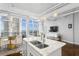 Open concept living space with modern kitchen island and ocean views at 175 2Nd S St # P-08, St Petersburg, FL 33701