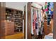 Organized walk-in closet with custom shelving for shoes, clothes, and accessories at 175 2Nd S St # P-08, St Petersburg, FL 33701