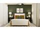 Bedroom with wood bed frame and green accents at 17649 Shirewood Way, Land O Lakes, FL 34638