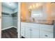 Clean bathroom with granite countertop and white cabinets at 1881 N Hercules Ave # 803, Clearwater, FL 33765