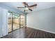 Bedroom with dark hardwood floors and sliding glass doors to patio at 1881 N Hercules Ave # 803, Clearwater, FL 33765